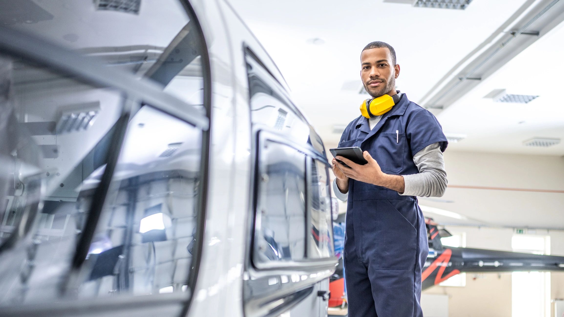 Technician using digital tools for vehicle service