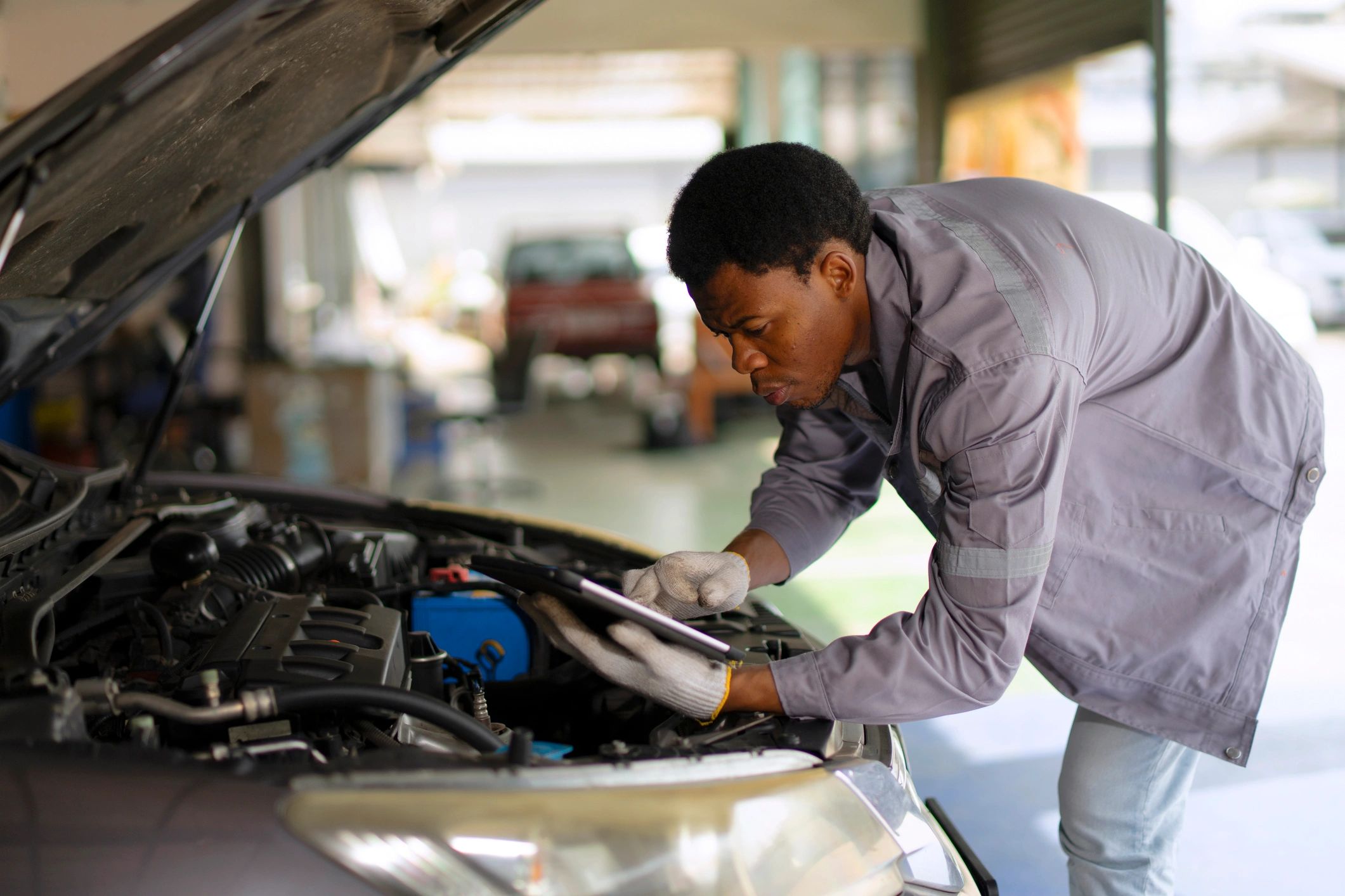Mechanic performing automotive maintenance