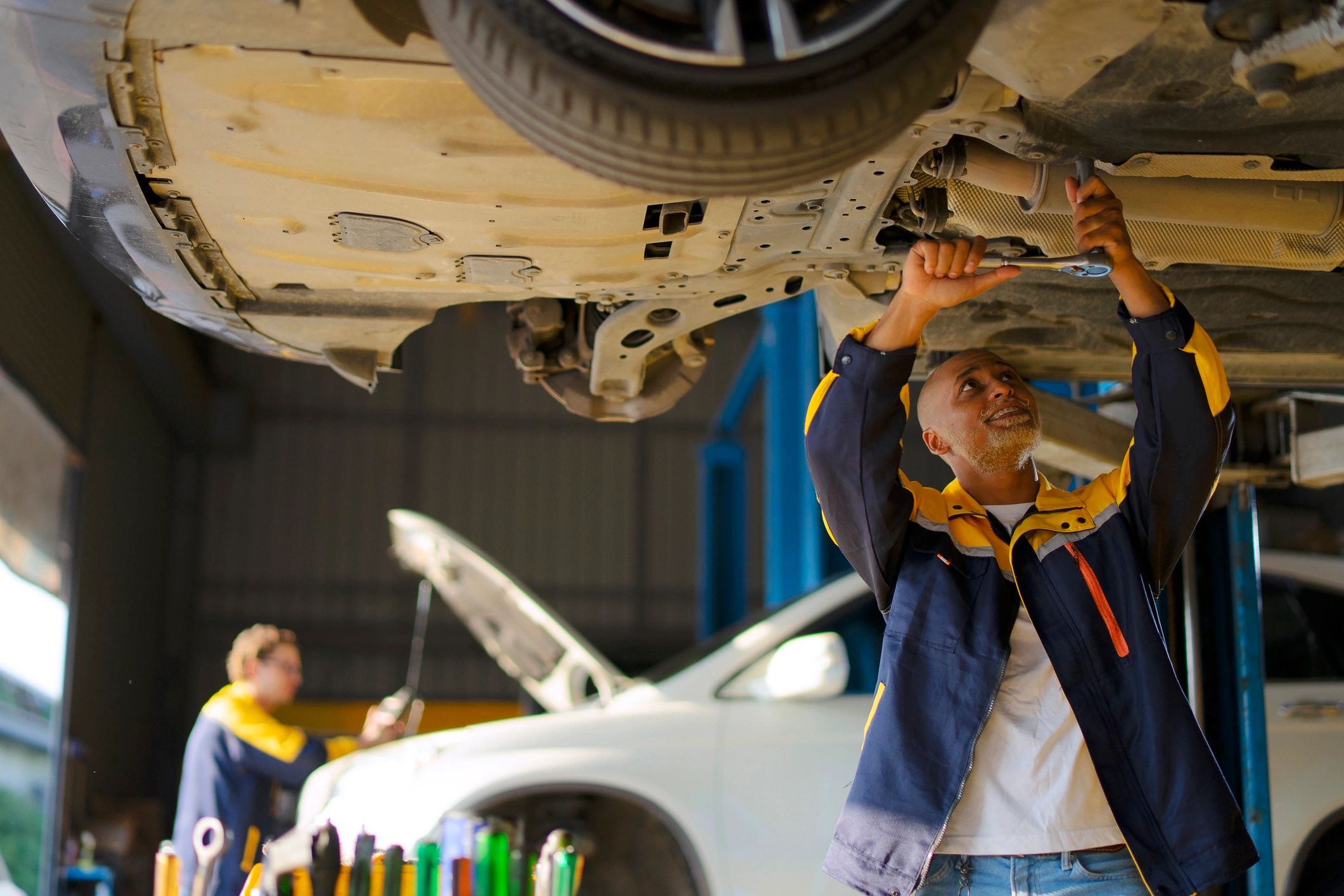 Mechanic working on a vehicle for a customer